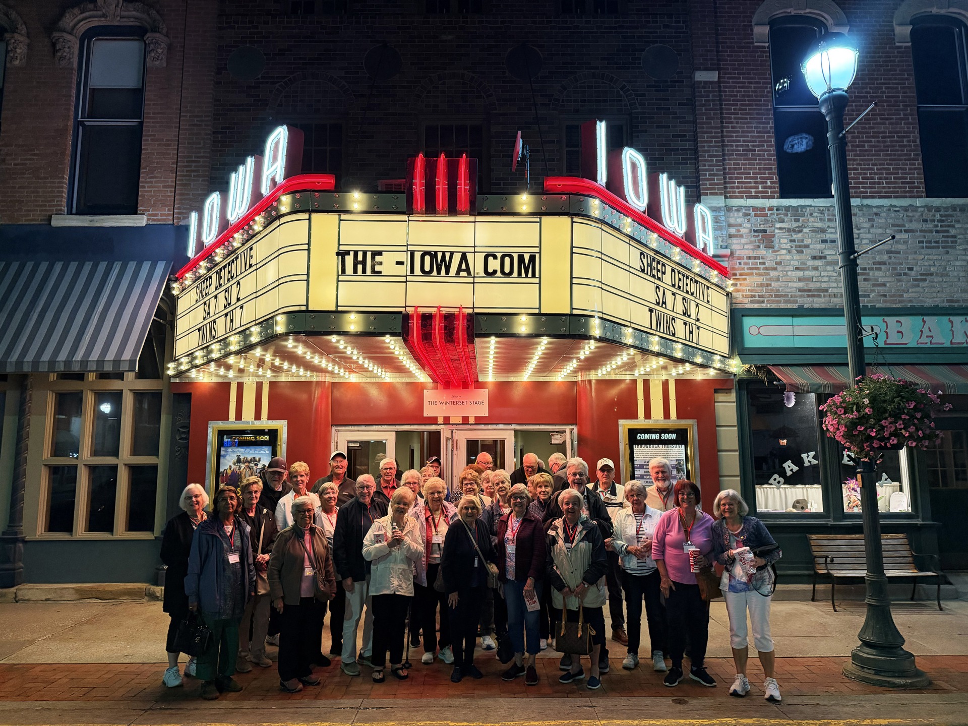 The Iowa Theater sign lit up at night in Madison County, Iowa.